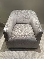 Front view of grey and cream geometric patterned upholstery