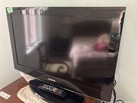 32-inch Samsung flat screen TV showing front view with screen and stand.