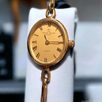 Close-up front view of the oval watch face showing Christian Bernard Paris branding, gold-tone dial with Roman numerals and quartz marking.