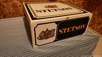Closed Stetson box with brand name and emblem on top