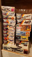 Photo showing stacked boxed Matchbox scale model aircraft kits ready to build.