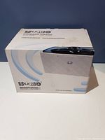 Box of Isonic Ultrasonic Cleaner showing product image and branding