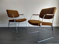 Pair of chairs front view showing shape, upholstery, frames