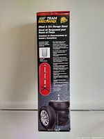 Photo of side of box showing branding, product image, and feature descriptions in Spanish, English, and French.