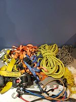 Various ratchet straps, ropes, chain, and nets together