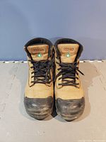 Front view of pair of tan Dakota ladies work boots with black toe caps and black laces, showing brand tag on tongue.