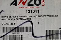 Label showing product details for BMW 3 Series E36 1992-1998 2 door 1 piece projector HLG2 halo black clear amber headlight