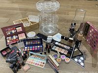 Overview of all acrylic stands, brushes and cosmetics on wood floor