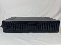 Front view of Harman Kardon EQ8 showing full set of sliders and power switch