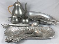 Full lot including tea pot, creamer, sugar bowl, oval salad bowl, rectangular platter, and salad utensils.