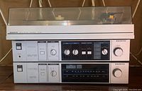 Full front view showing the Sanyo stereo system with amplifier and tuner units stacked.
