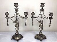 Both candelabras side by side, full view of lot