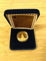 1994 Canadian Remembrance Proof Dollar coin in blue velvet display box with certificate inside lid