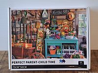 Front view showing vibrant garden tools, potting table, flowers, and window in potting shed puzzle box.