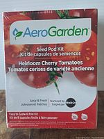 Front of the AeroGarden Seed Pod Kit box showing heirloom cherry tomatoes and product name.