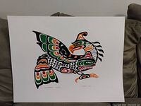 Front view of the signed First Nations Thunderbird print, vibrant colors and stylized Indigenous art motifs visible.