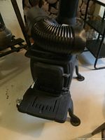 Front view showing door, ashtray, and front cooking plate removed