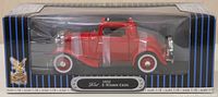 Front view of the 1932 Ford 3-Window Coupe diecast model in original packaging showing red car with whitewall tires under clear plastic display window.