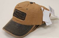 Four brown Duck Dynasty caps stacked and showing front embroidered logo and distressing on bill