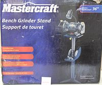 Front of the product box showing title, brand, and key features like height adjustment to 36 inches, heavy duty cast iron base, built-in accessory compartment, pre-drilled slots, and 2-year warranty.