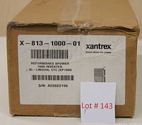 Front of the box with label showing Xantrex XPower 1000 inverter, model X-813-1000-01, bilingual CTC (XP1000), serial number A22022196