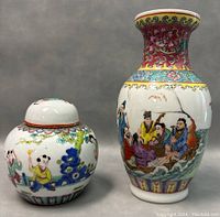Front view of vase and ginger jar side by side showing detailed painted scenes on both pieces.