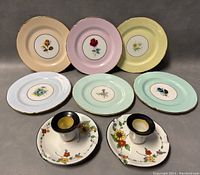 All items displayed: six floral Hammersley plates with pastel tones and two Shelley lustreware candleholders with floral dish bases.