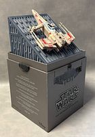 Star Wars T-65 X-Wing drone displayed on top of the box showing the packaging text and drone design.