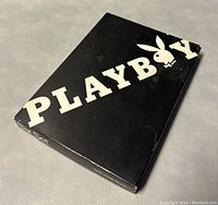 Original black box with white Playboy logo, slightly worn edges visible.