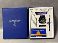 Full lot in original blue Waterman Paris box showing the pen, ink bottle, some cartridges, cap, and instruction booklet in fitted foam insert