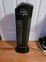 Front view of Ionic Pro air purifier showing vents, branding and base.