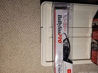 Photo showing the sealed original box of Baby Bliss Pro Ceramic Xtreme Curling Iron with branding and product name visible