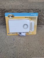 Photo showing Hampton Bay Wireless MP3 Doorbell Kit new in original packaging with visible doorbell chime receiver and wireless button.