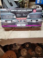 Photo of the product's original box showing the front view and installation instructions.