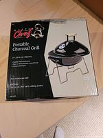 Box of Master Chef Portable Charcoal Grill with product image and specifications visible.