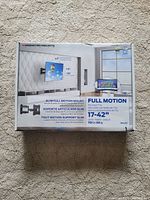 Box of Monster Mounts full motion TV wall mount showing front with product details including compatibility for 17-42 inch TVs and 70 lbs max weight.
