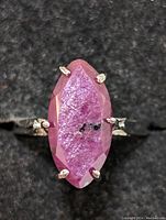 Close-up front view of the sterling silver marquise ruby ring showing the ruby's faceted surface and natural inclusions.