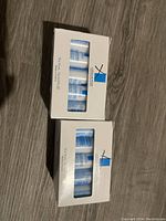 Photo of two white sample boxes containing La Roche Posay skincare tubes, 15 in each box visible.