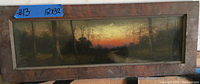 Framed rectangular landscape painting showing silhouettes of trees with a sunset or sunrise sky, in a worn wooden frame.
