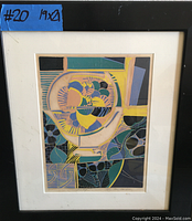 Framed abstract print artwork with geometric and organic shapes in multiple colors, signed by artist.