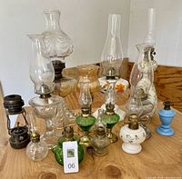 Group view of all lamps on table showing range of colors and styles