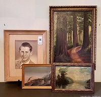 Group shot of three framed oil paintings and one framed portrait.