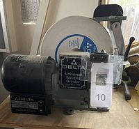 Front view of Delta Universal Wet/Dry Grinder on wooden bench