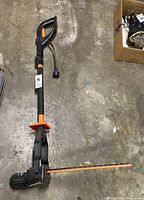 Photo of Remington RM3017HP electric hedge trimmer showing full length including the handle, blade, and power cord area.