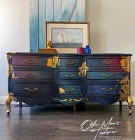 Front view of the dresser showing the full piece with 9 drawers, jewel tone chalk paint, and gold leaf accents.