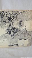 Front cover of Revolver album sleeve showing Klaus Voormann illustration and minor edge wear