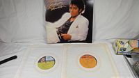 Michael Jackson Thriller original jacket propped open showing front cover, two lyric inner sleeves and vinyl record