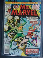 Front cover of Ms. Marvel #2 comic book showing Ms. Marvel fighting villains Scorpion and Destructor with bright colors and title text.