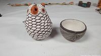 Photo showing the miniature owl figurine and the ceramic bowl side by side on a white background.