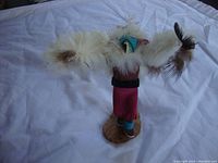 Front view of the Kachina Eagle Dancer figurine showing detailed feathers, head, and attire.